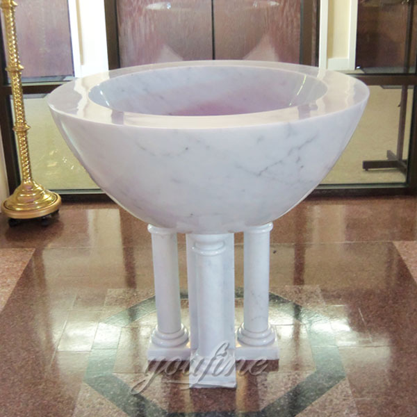 Indoor White Marble Catholic Small Baptismal Font in a Church on Stock